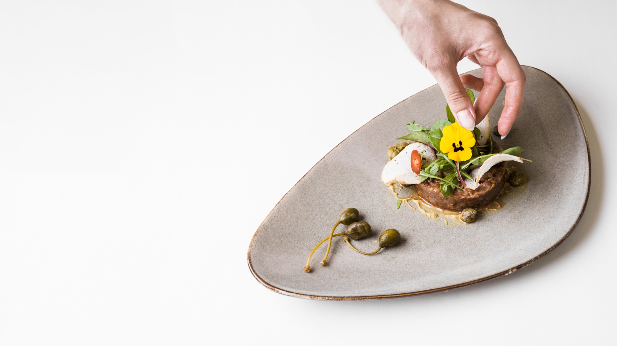 bucatar prepares local dish on wooden table
